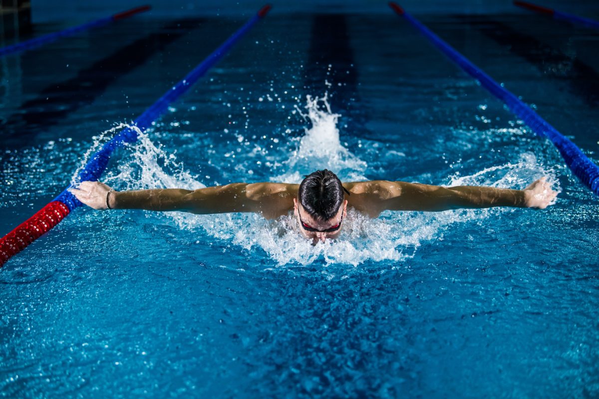 A man swimming in the pool