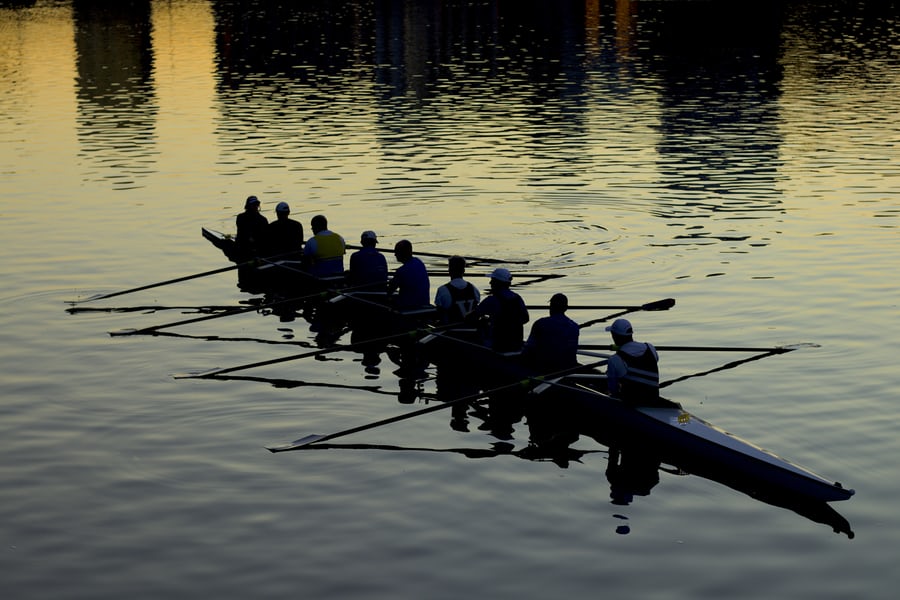 Team of men rowing